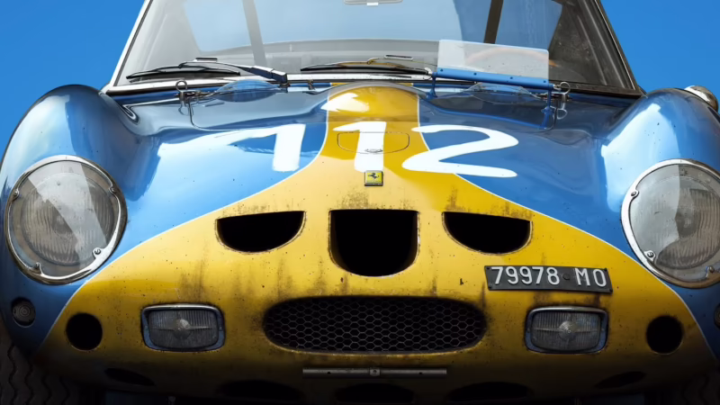 What is the lady in blue Ferrari?
