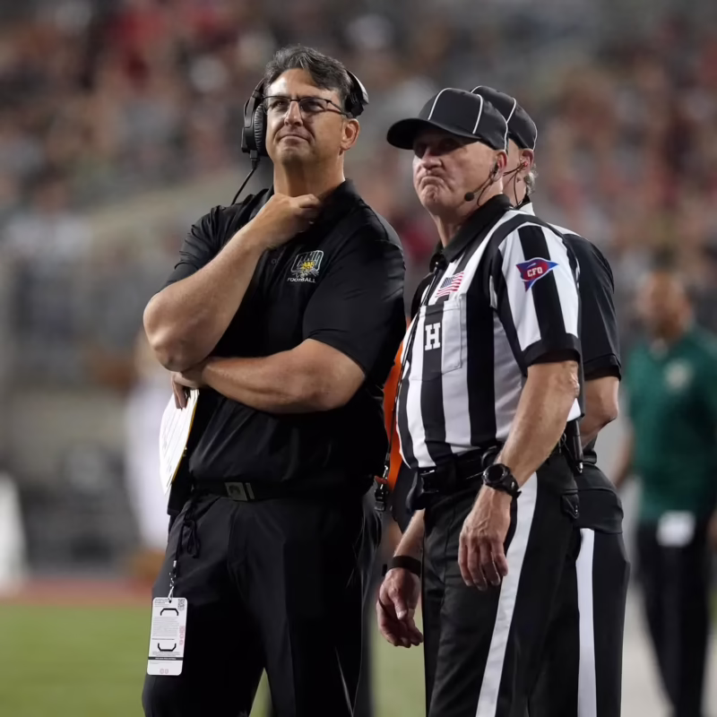 How old is coach Brian Smith?