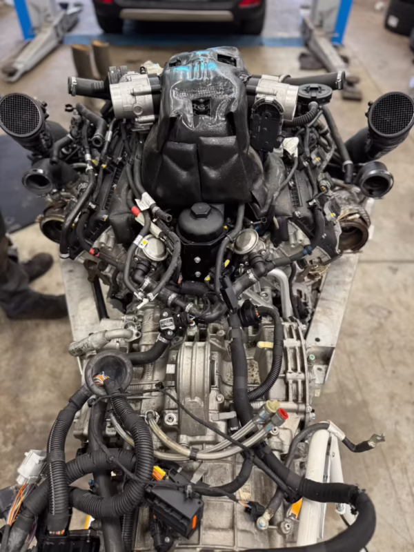 Who makes McLaren V8 engines?