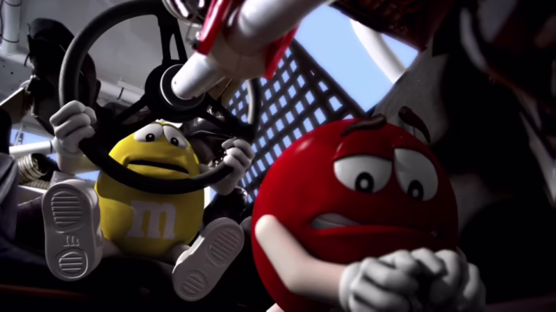 Who drove the M&M car in 2010?