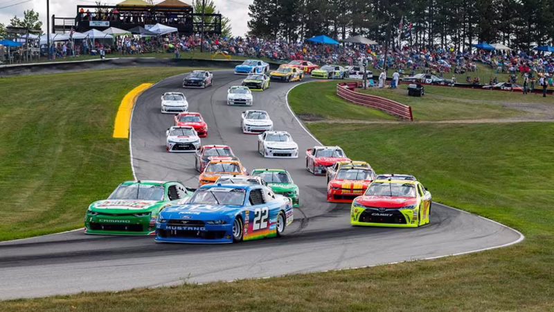 What FM radio station is the NASCAR race on?