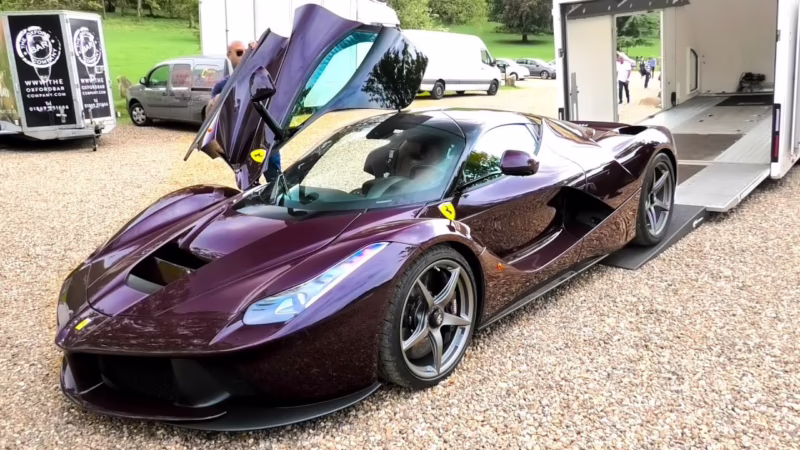 Who owns a purple Ferrari?
